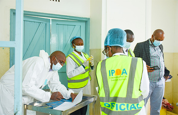 IPOA investigators observe a post-mortem examination at the City Mortuary